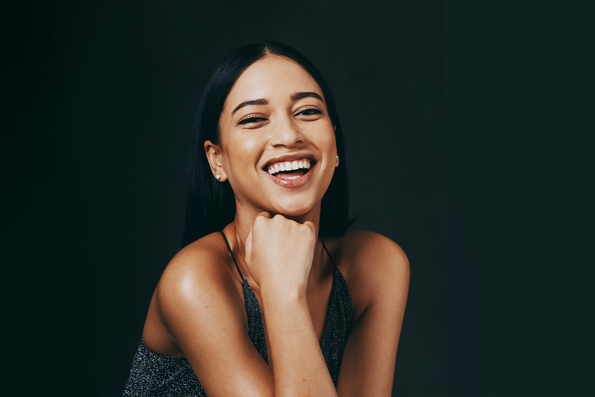 a woman smiling and posing for the camera