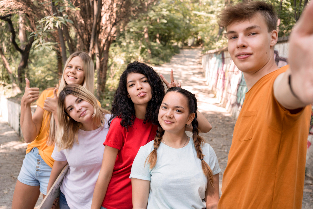 a group of teenagers posing for the camera